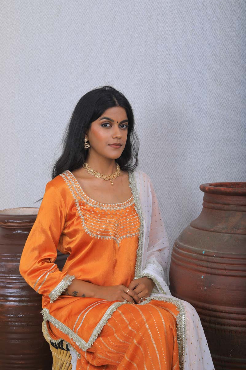 Orange Strappy Indian Traditional Outfit with a soothing embroidery
