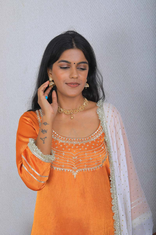 Orange Strappy Indian Traditional Outfit which is perfect for ethnic occasions.