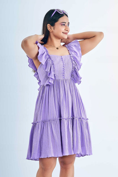 Girl wearing a Ruffled Lavender Dress showing it off in style