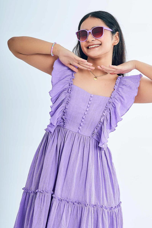 Girl wearing a Ruffled Lavender Dress with a chocolate jar in her hand