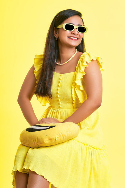 Girl wearing a Ruffled Yellow Dress with glasses