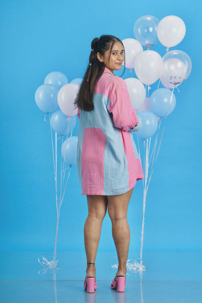 Girl wearing a loungewear patchwork shirt with pink and blue fabric patches seen from behind