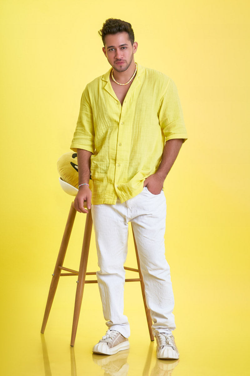 Guy wearing an oversized yellow loungewear shirt