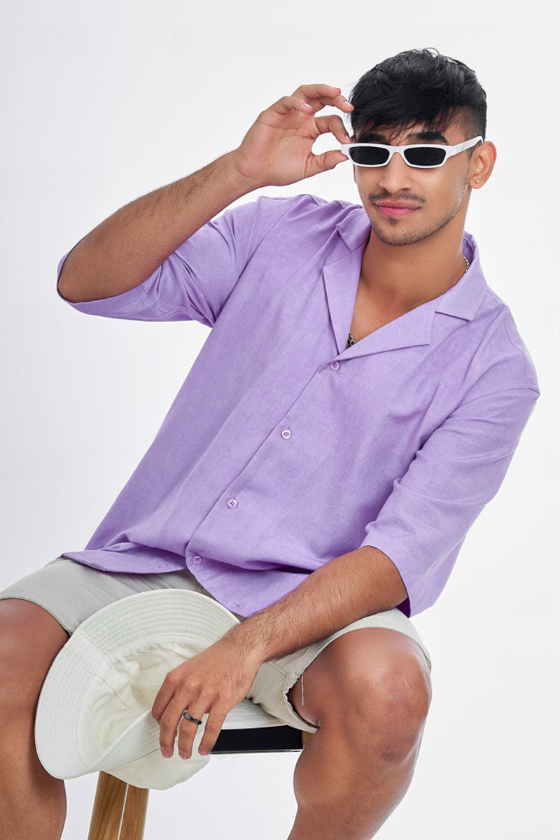 Guy wearing an oversized lavender unisex shirt